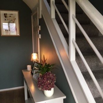 Green and white hall and stairs