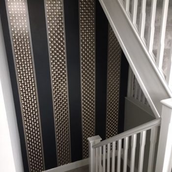 Black and silver wallpapered stairway