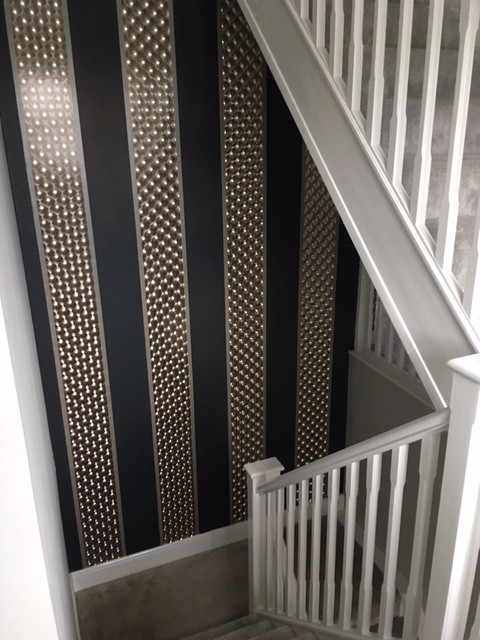 Black and silver wallpapered stairway