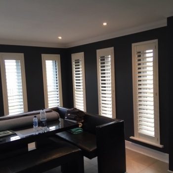 Monochrome sitting room with blinds
