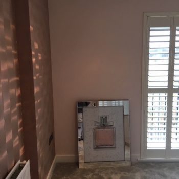 Peach and rose-gold bedroom, textured wall