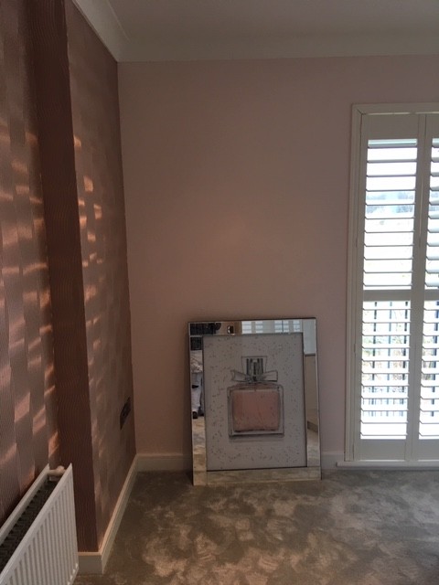 Peach and rose-gold bedroom, textured wall