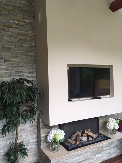 Slate-effect wallpaper with fire place